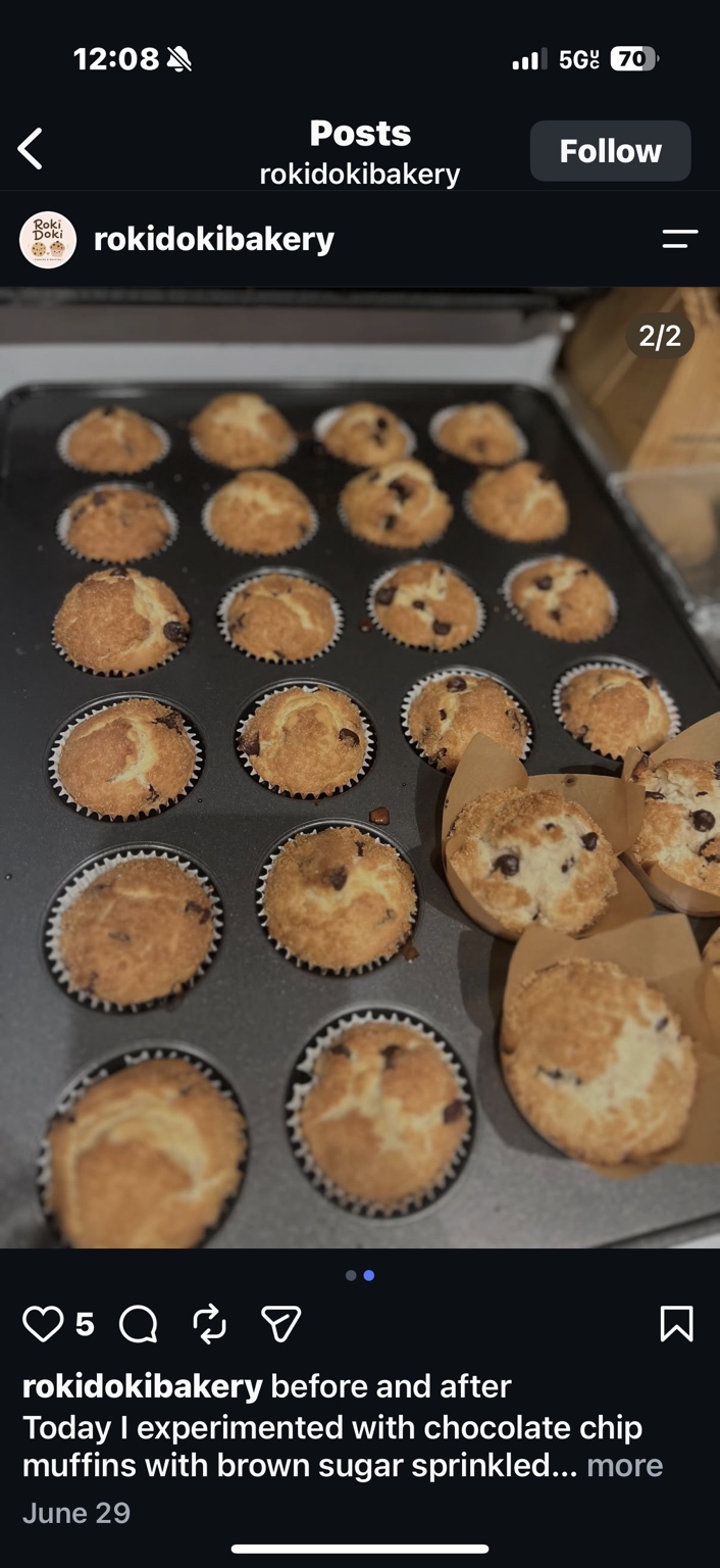 Freshly baked chocolate chip muffins in a baking tray